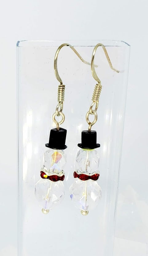 Clear faceted AB bead with red crystal rondell collar. 1.25" long