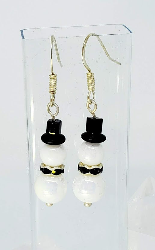 Luminate Pearl AB Snowman with Black Rondell collar. 1.25" long. Silver tone wire.