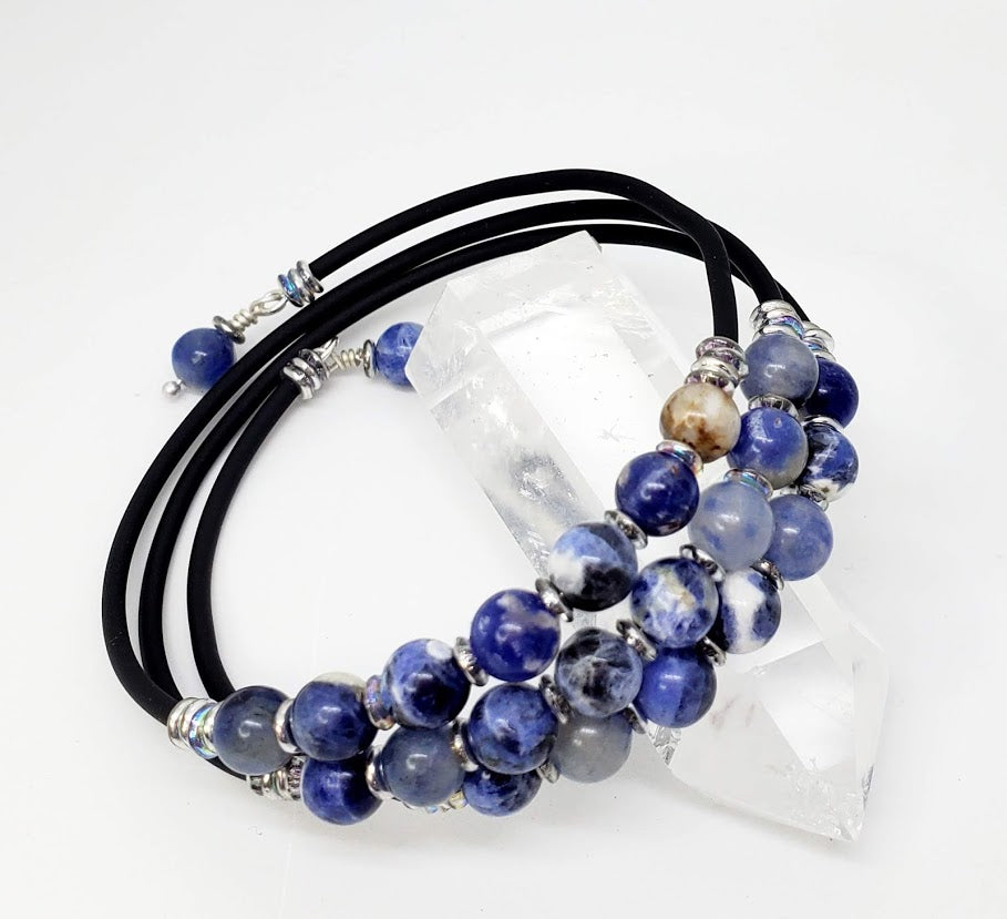 6 mm Sodalite beads in a 3 tier memory wire bracelet. Sodalite has a high salt, calcium & manganese content. This helps it to have a harmonizing and soothing effect. Blue stones in general strengthen communications, creativity, inspiration and intuition.