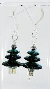3 Tier Swarovski Emerald Crystal with Crystal AB bicone topping. Made with Sterling Silver wire. The photo doesn't do these earrings justice. They are translucent green, very pretty. 1.25" long.
